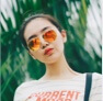 portrait photo of Olivia, the commenter - woman with orange polarized sunglasses